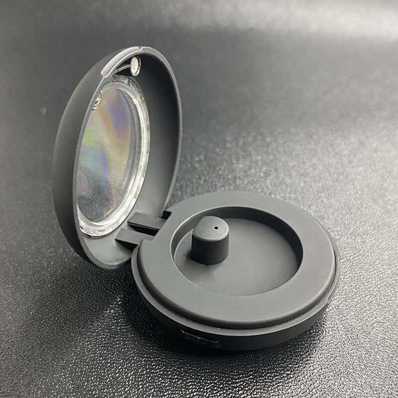 Dixsg Universal Charger for Smart Rings - Black, open view showing transparent lid and magnetic connector.