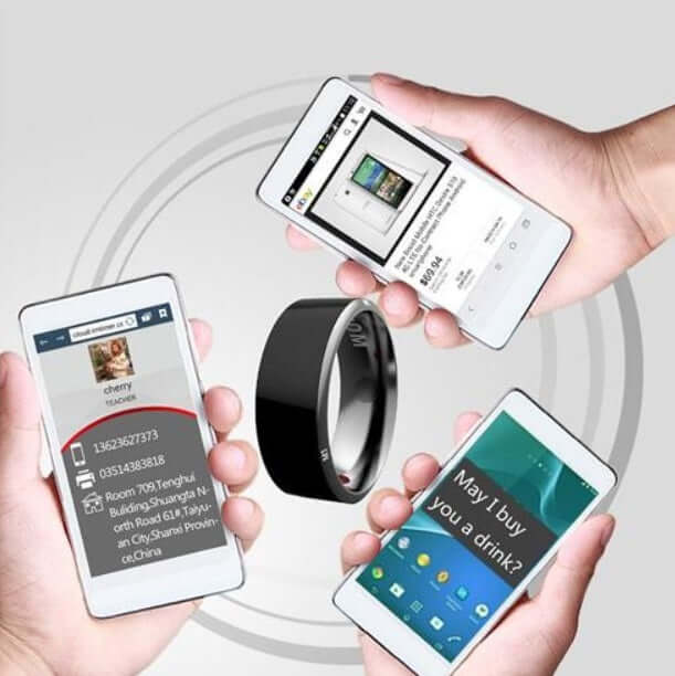 Four hands holding smartphones around a Jakcom R3 Smart Ring in black, illustrating smart ring functionality.