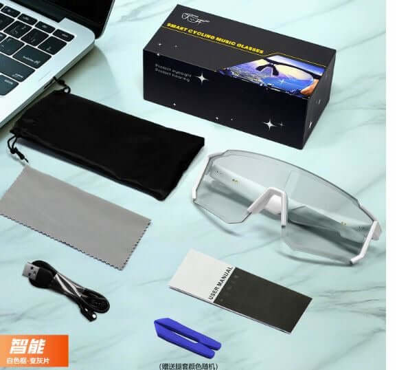Lige Pro 1 AI Sports Glasses in white frames with gray lenses, accessories, and box on a table.